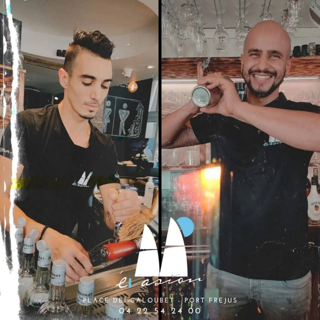 Deux barmans servent des boissons à L'Évasion, Port Fréjus. Coordonnées ci-dessous.